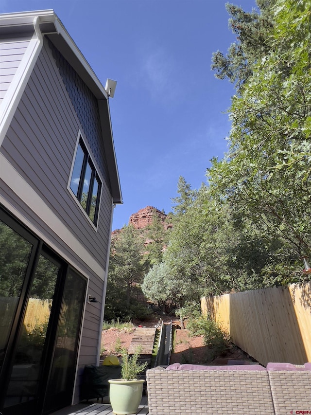 view of property exterior featuring fence