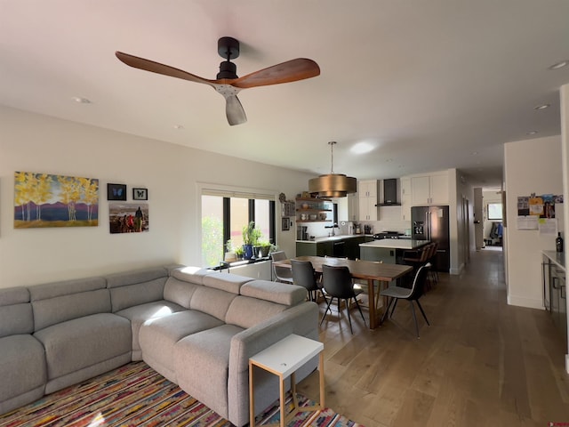 living area featuring recessed lighting, ceiling fan, and dark wood-style flooring