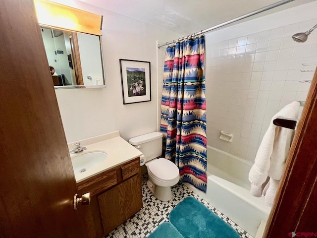 bathroom featuring vanity, toilet, and shower / tub combo with curtain