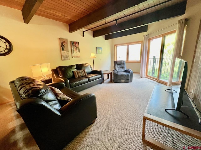 living area featuring carpet floors, beamed ceiling, and wooden ceiling
