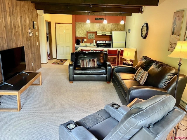 carpeted living room featuring wooden walls and beam ceiling