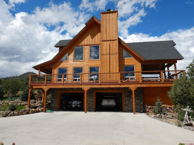 view of home's exterior with a balcony and a garage