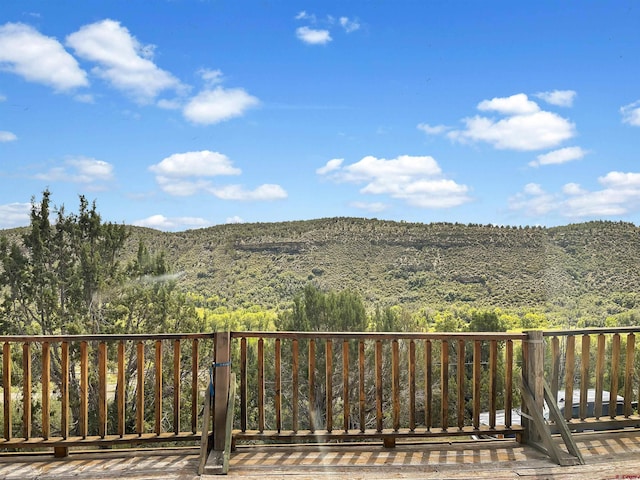 property view of mountains featuring a forest view