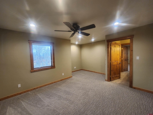 unfurnished bedroom with light colored carpet and ceiling fan