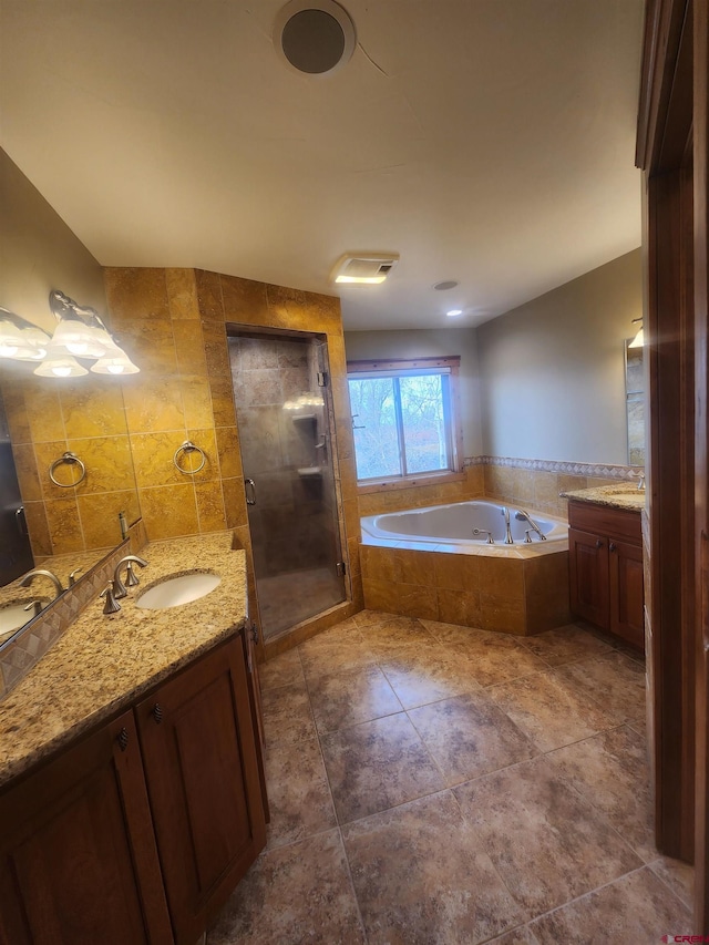 bathroom featuring vanity, tile walls, independent shower and bath, and tile patterned flooring