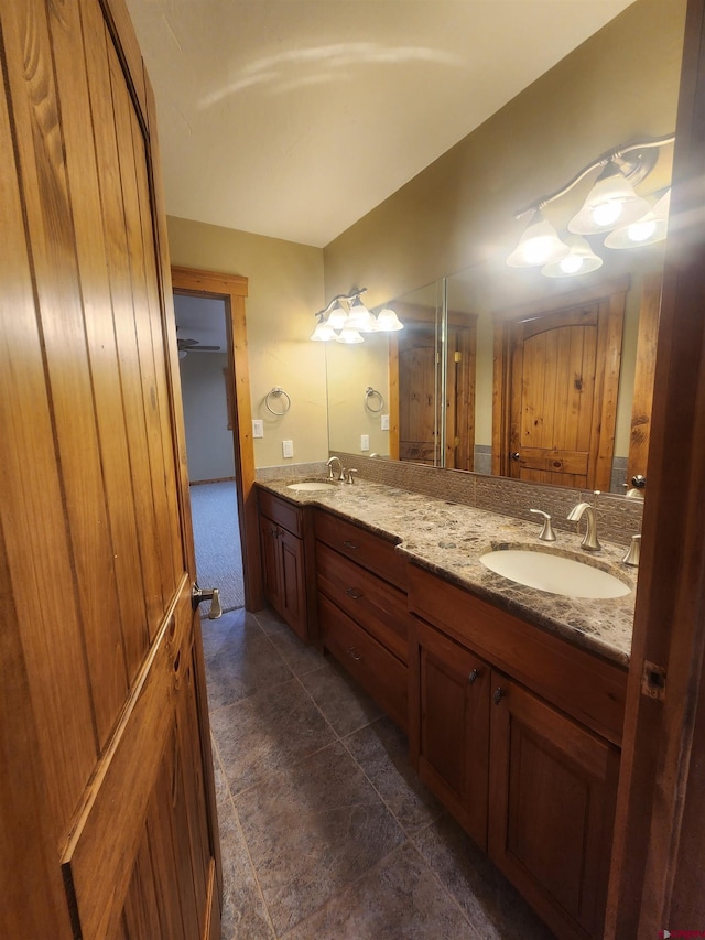 bathroom featuring tile patterned flooring and vanity