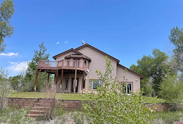 view of front of home featuring a wooden deck