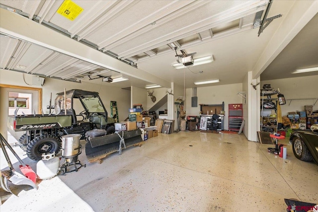 garage featuring a garage door opener and electric panel