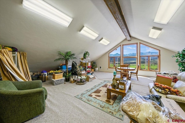 carpeted living room featuring vaulted ceiling with beams