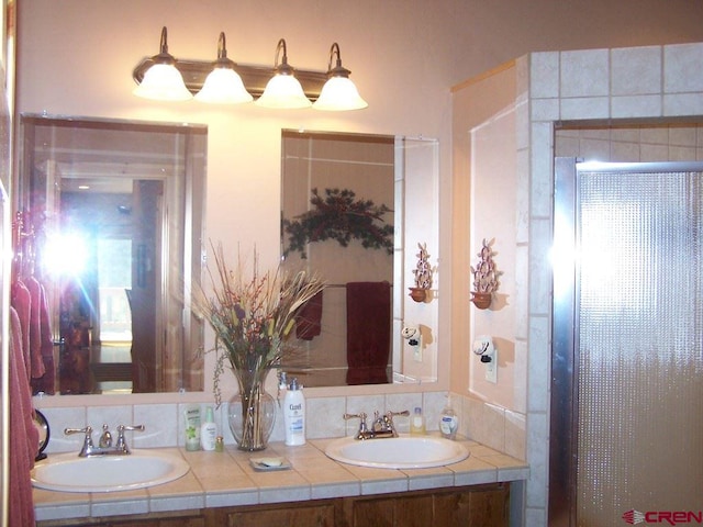 full bath with a sink and double vanity