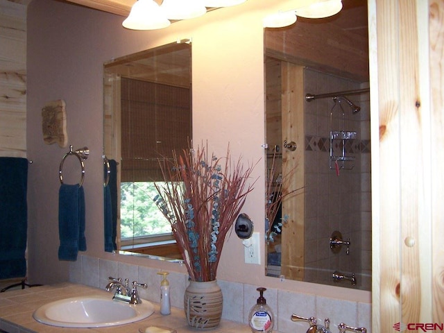 bathroom with vanity and shower / tub combination