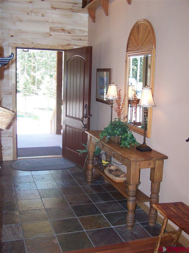 entryway featuring stone tile floors