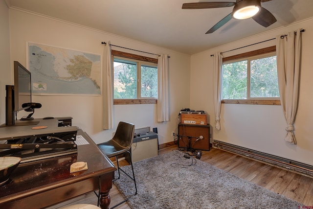 office featuring ceiling fan, crown molding, wood finished floors, and plenty of natural light