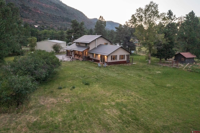 birds eye view of property featuring a mountain view