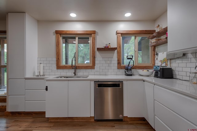 kitchen with open shelves, stainless steel dishwasher, white cabinets, and a sink