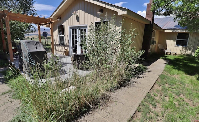 view of side of home with french doors