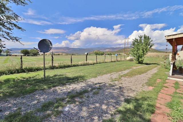 view of yard featuring a mountain view and a rural view