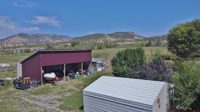 mountain view featuring a rural view