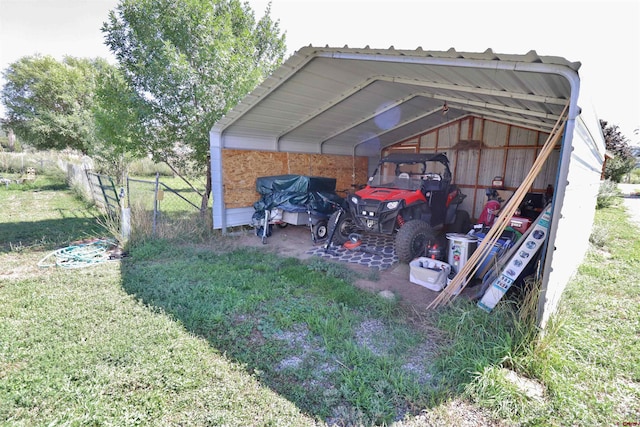 view of outdoor structure featuring a yard and a carport