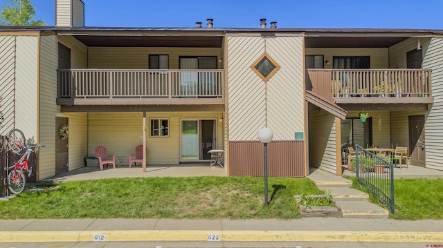 exterior space with a patio area and a balcony