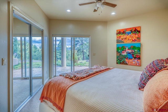 carpeted bedroom featuring access to exterior, ceiling fan, and multiple windows