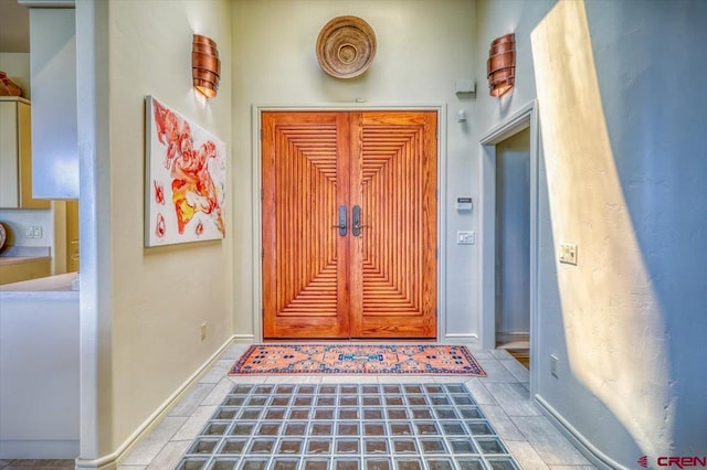 doorway with tile patterned flooring