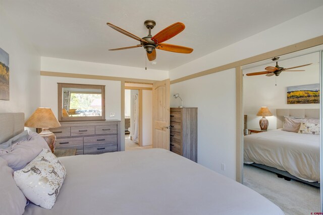 carpeted bedroom featuring ceiling fan