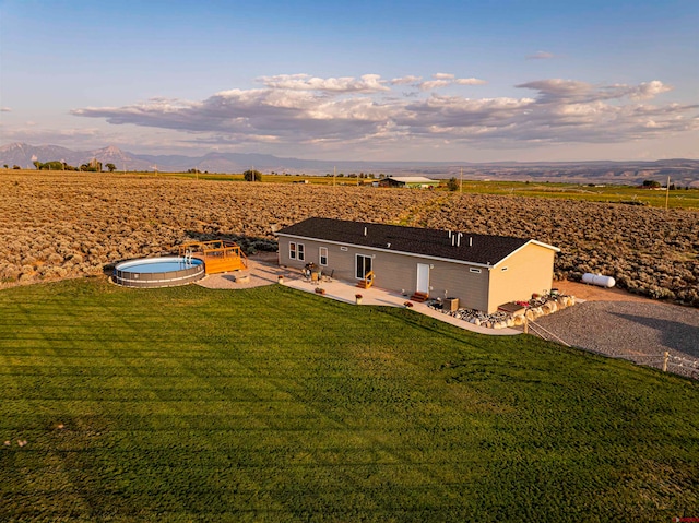 birds eye view of property featuring a rural view and a mountain view