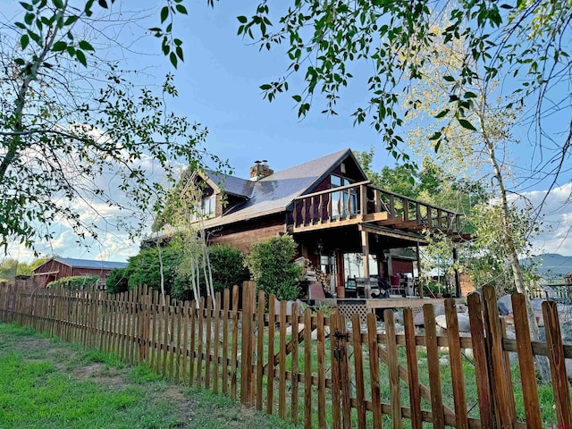 rear view of property with a deck