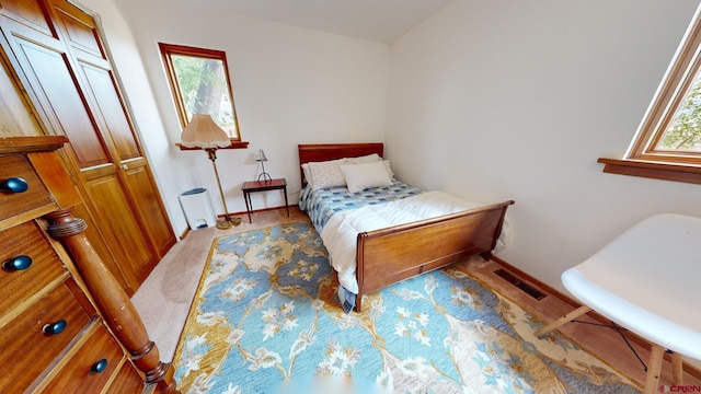 carpeted bedroom with a closet