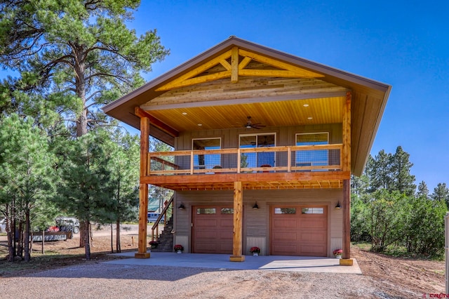 view of front of property with ceiling fan and a garage