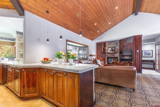 kitchen featuring decorative light fixtures, wood ceiling, a stone fireplace, high vaulted ceiling, and a kitchen island