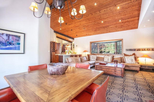 dining room with a towering ceiling, wood ceiling, and a chandelier