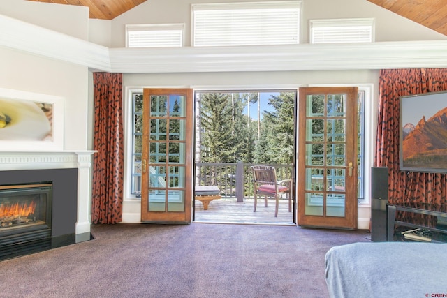 interior space with wood ceiling, high vaulted ceiling, and carpet floors