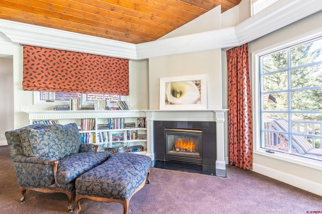 sitting room featuring carpet flooring, wooden ceiling, and vaulted ceiling