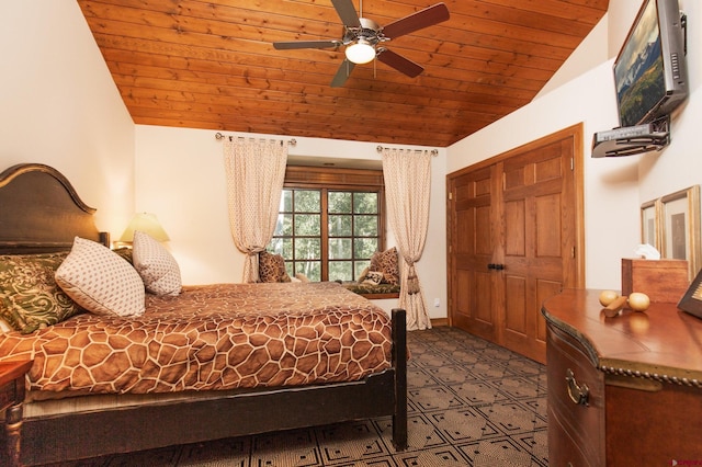 bedroom featuring wood ceiling, lofted ceiling, ceiling fan, and a closet