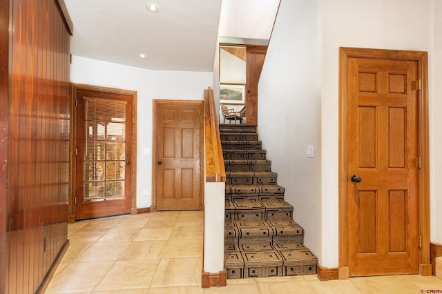 stairway featuring tile patterned floors