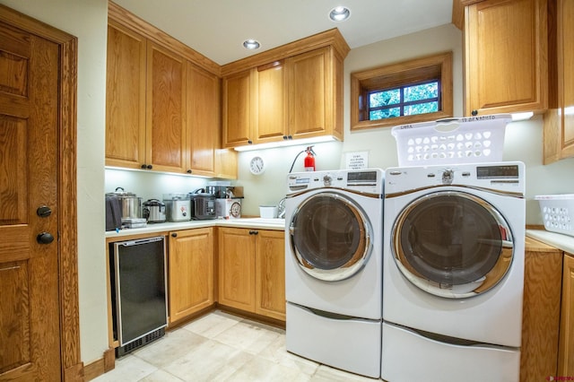 laundry area with cabinets, separate washer and dryer, wine cooler, and light tile patterned flooring