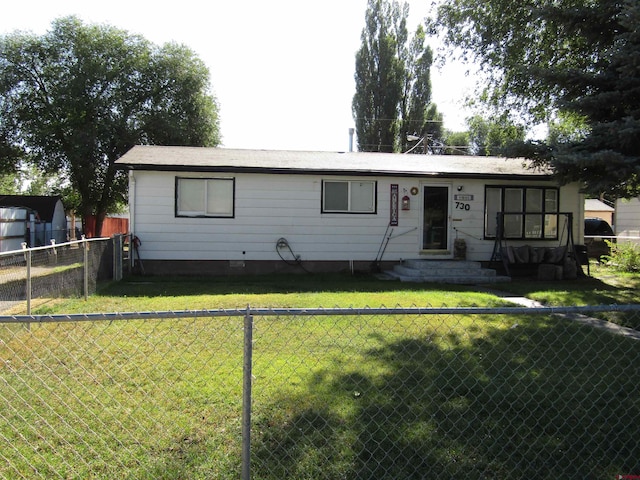 ranch-style home with a front lawn