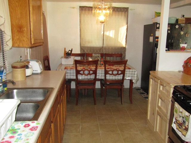 730 Washington St, Monte Vista, CO 81144 - dining space featuring a chandelier and light tile patterned floors