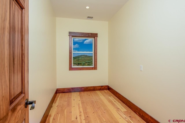 unfurnished room featuring light hardwood / wood-style floors