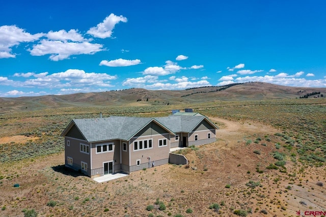 bird's eye view with a mountain view and a rural view