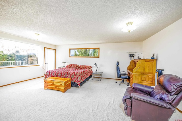 bedroom featuring carpet and a textured ceiling