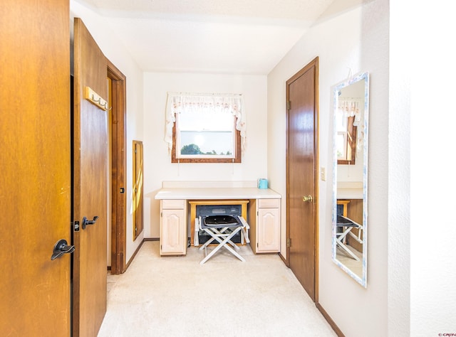 home office featuring light colored carpet