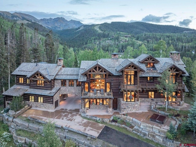 exterior space featuring a patio and a mountain view