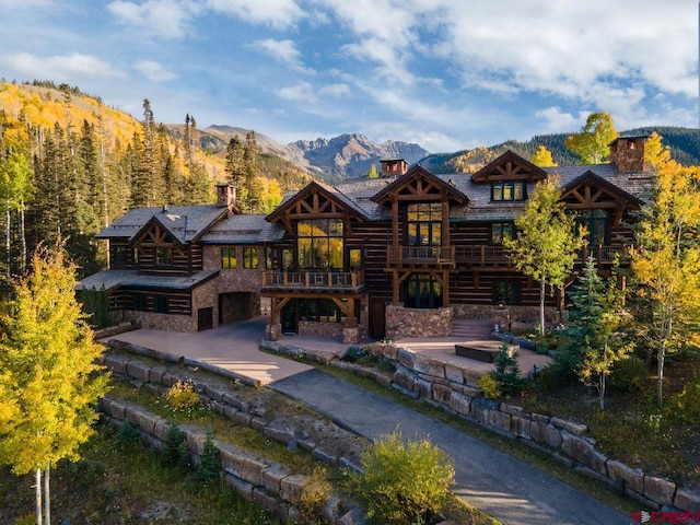 rear view of property with a mountain view