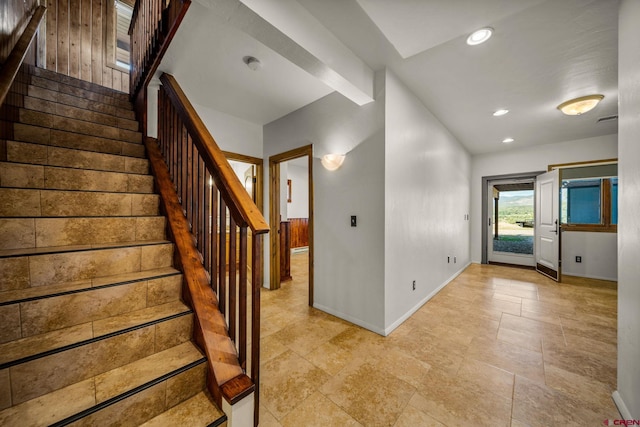 stairs with wood walls