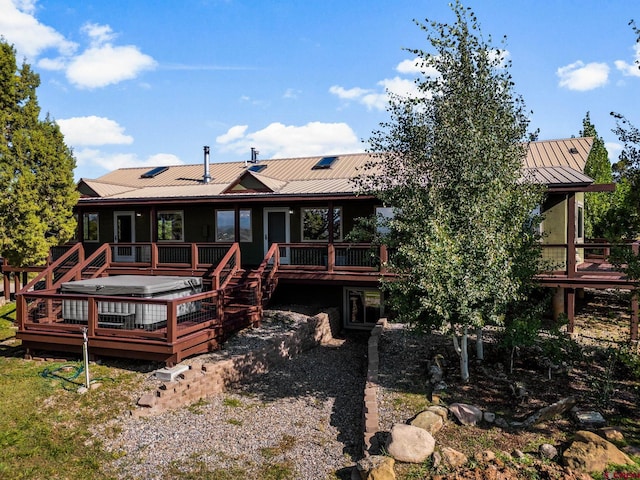 back of house with a wooden deck