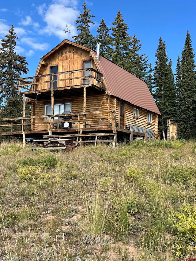 view of front of house with a wooden deck