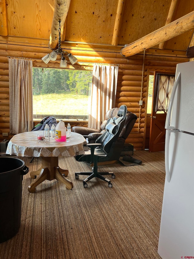 interior space with beam ceiling and rustic walls